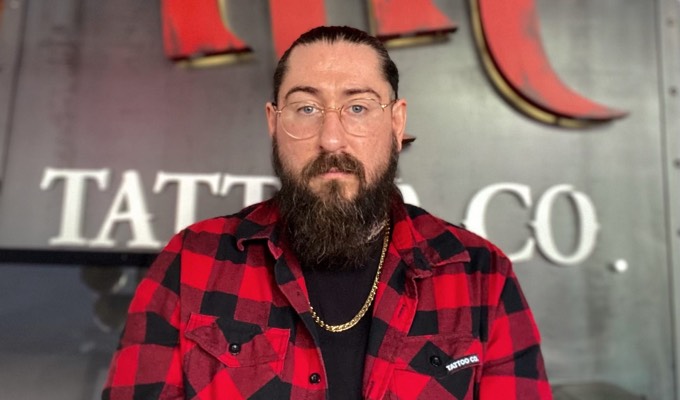 Adam Barker, assistant manager at Hart & Huntington Tattoo Co. Orlando