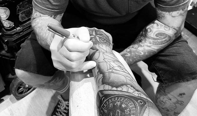 Gregg Adam getting tattooed by Jimmy Rogers